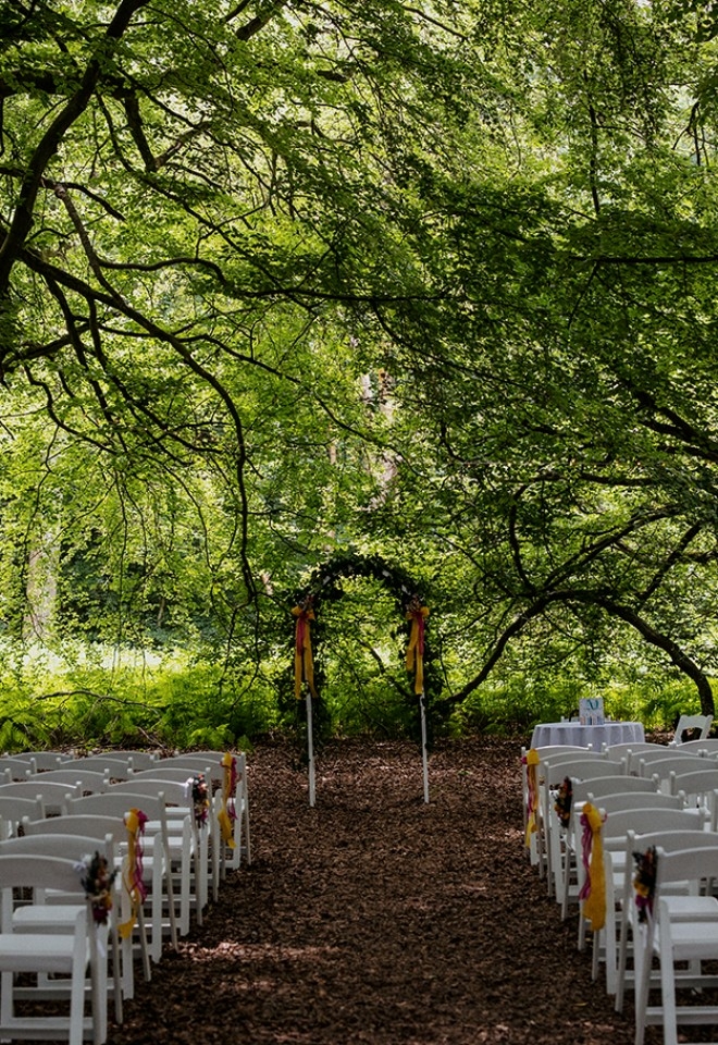 Wedding ceremony set up in the private woodland at Monkton Barn