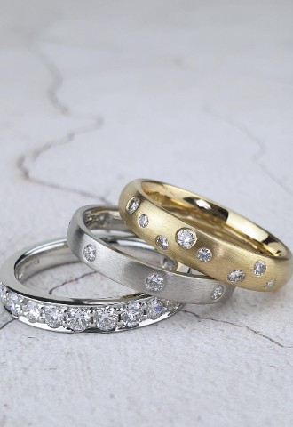 handmade diamond-set wedding rings in platinum and gold