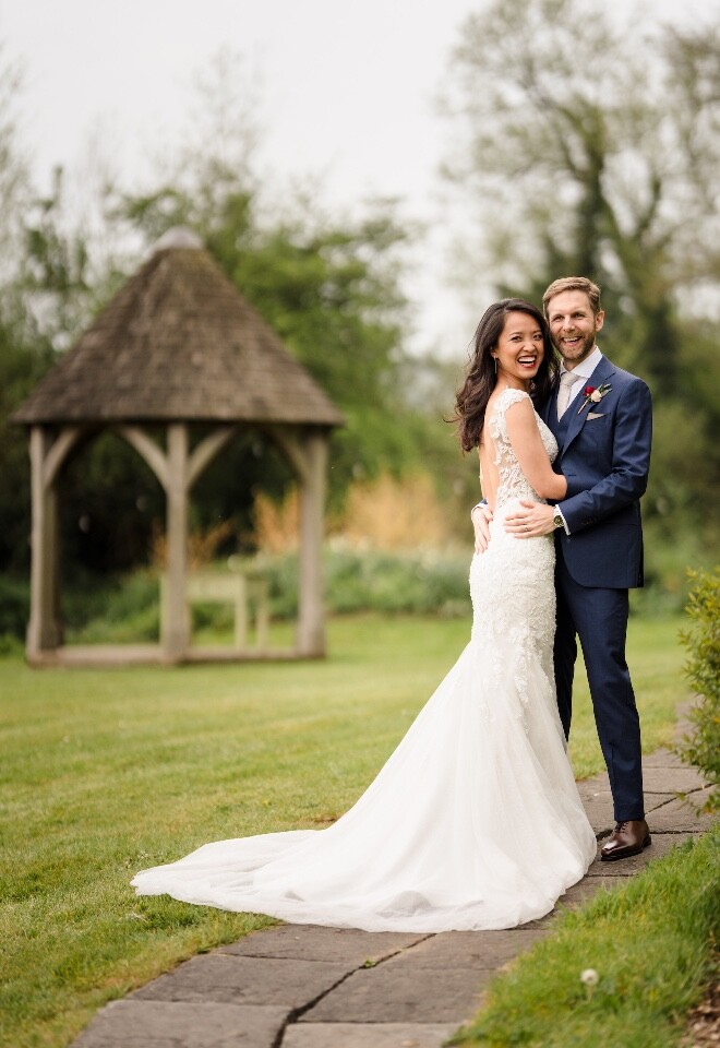 Bride and groom in the gardens at Priston Mill wedding near Bath.