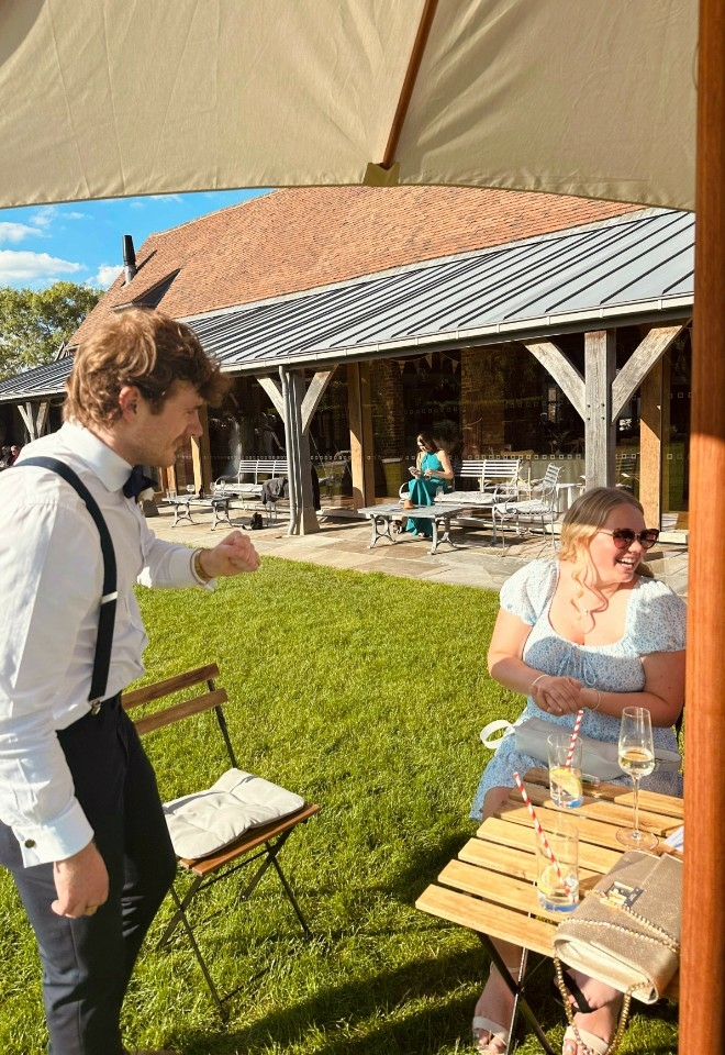 Nicky George performing magic at a wedding