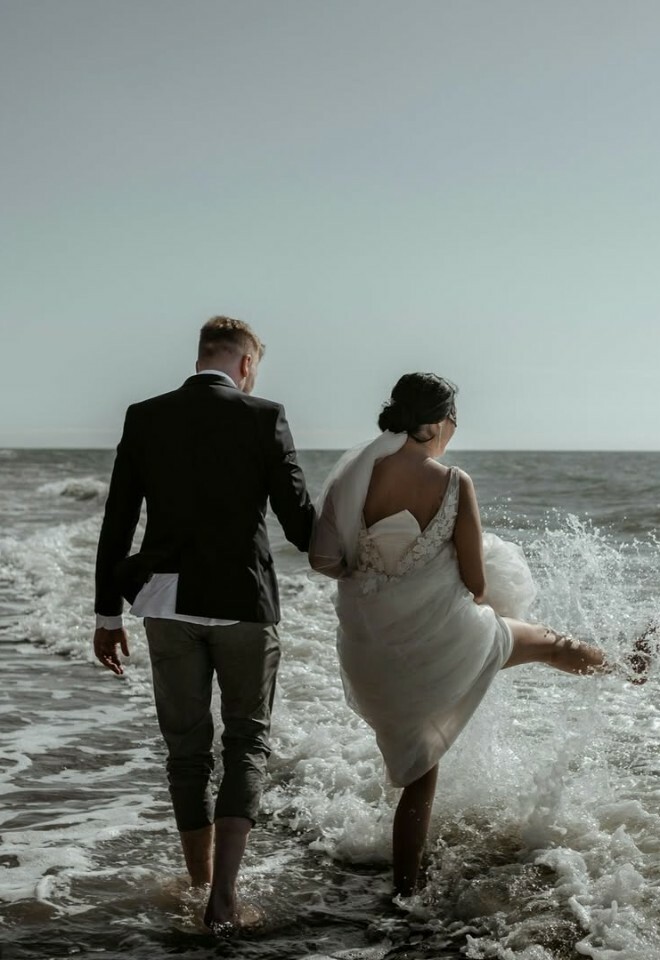Bride and groom in the sea
