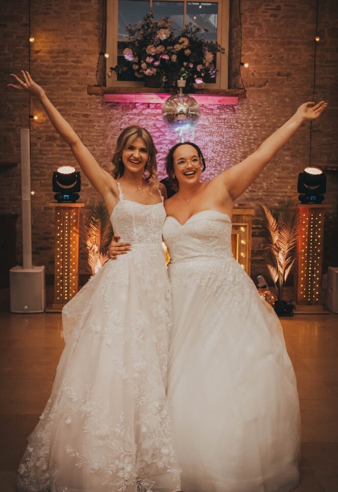 Two brides enjoying a moment on the dancefloor at Merriscourt