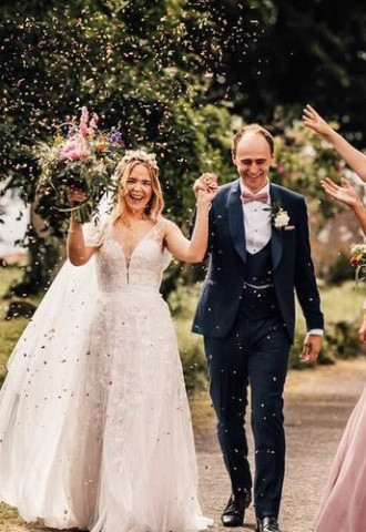 happy bride with half up hairstyle and airbrush makeup