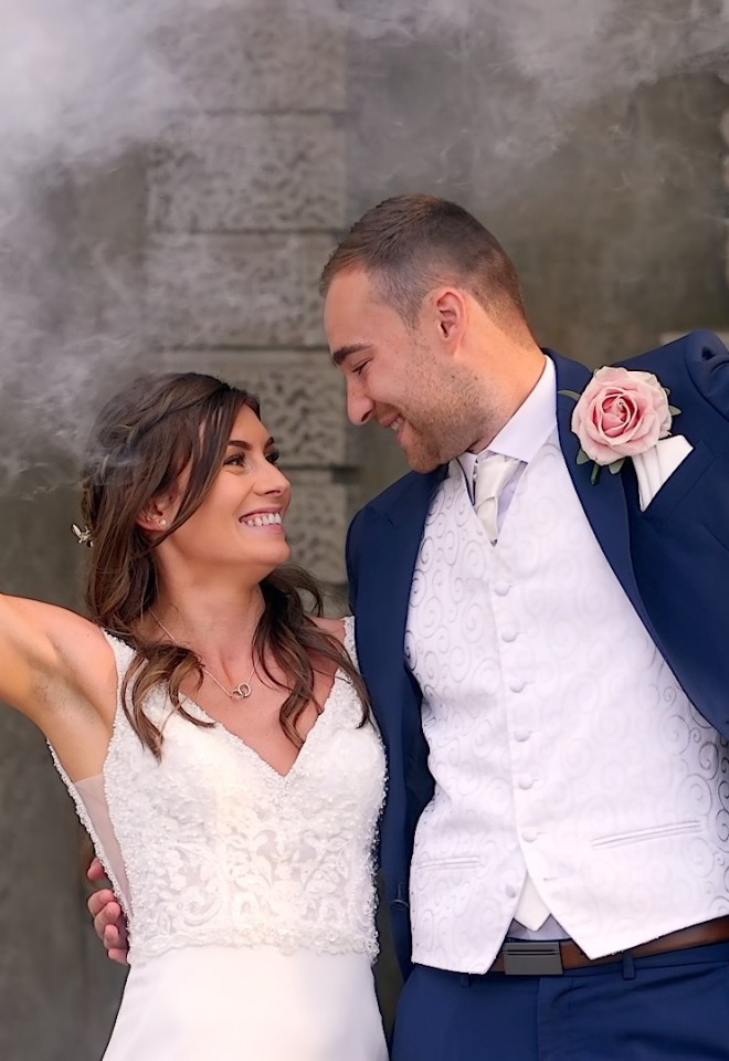 Bride and Groom holding smoke bombs at wotton house