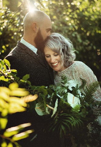 Bride and groom share a kiss, Time & Oath