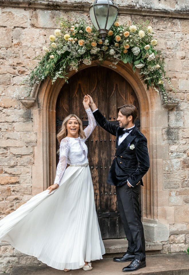 Bride and groom outside of wedding venue