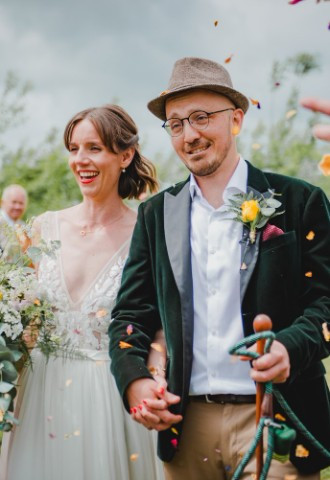 bride and groom outdoor wedding confetti cascade
