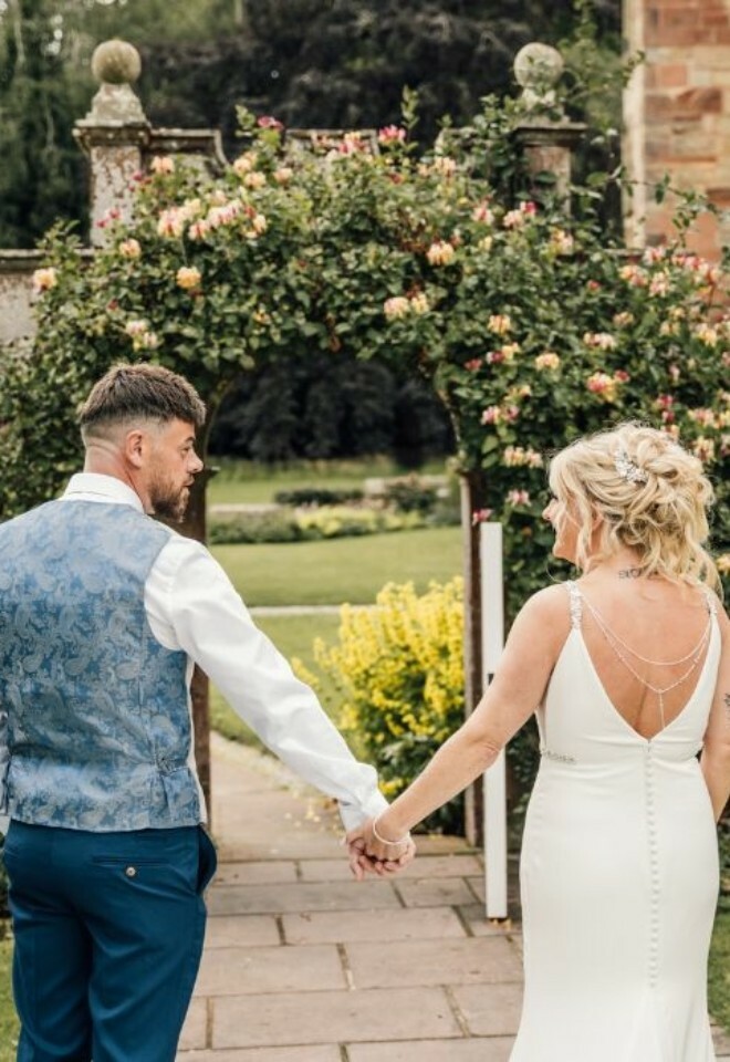 Couple by arch