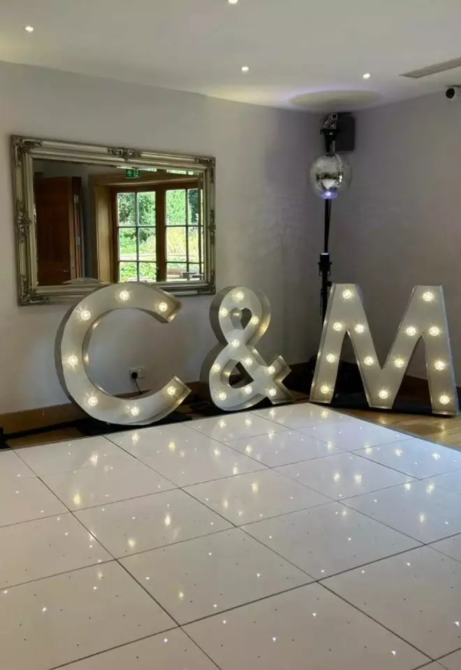 starlit dance floor, giant letters C&M & disco ball at Cotswold House Hotel & Spa for a wedding