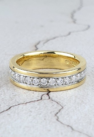 Yellow gold wedding ring with a line of small diamonds set in platinum
