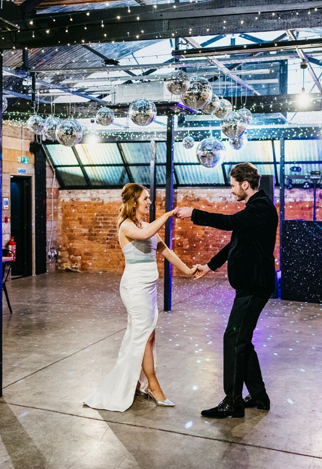 Couple dancing in workshop space