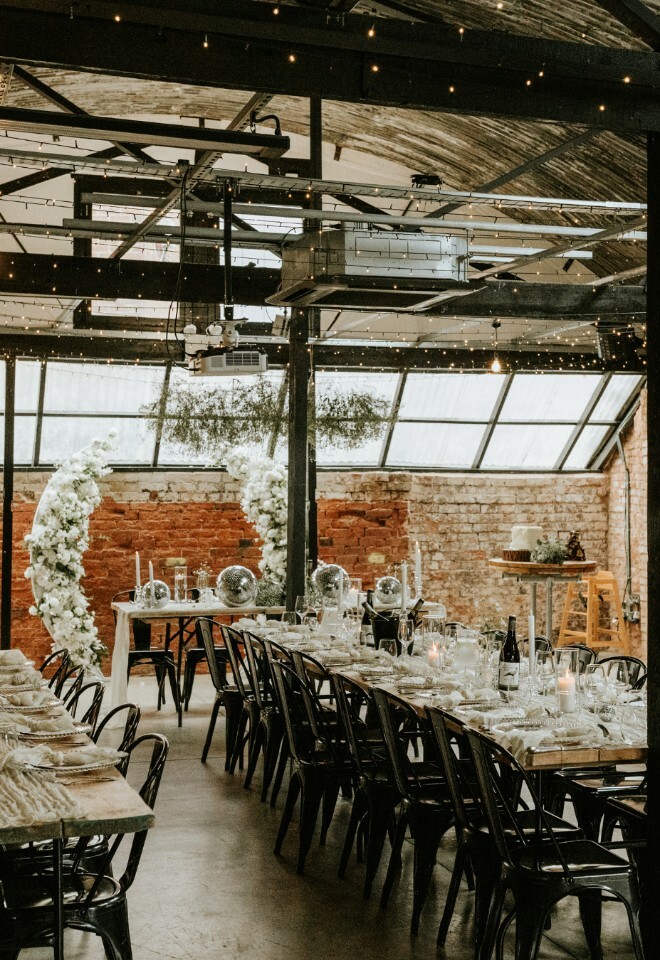 Wedding dining set up with white floral decor