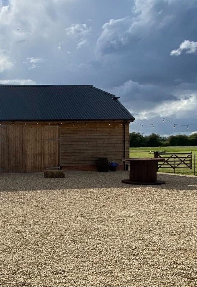 gravel courtyard at Bosleys Farm, Windsor Barn. fairy lights for the evening