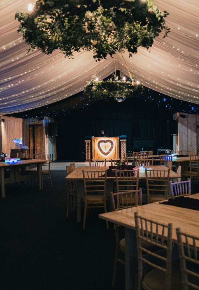 The marque set up for dining at a Warwickshire wedding venue