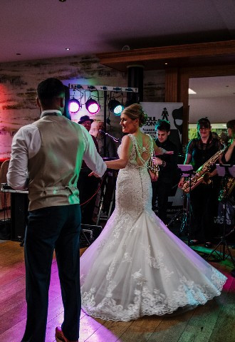 Bride and groom sharing their first dance at Gibbon Bridge Hotel