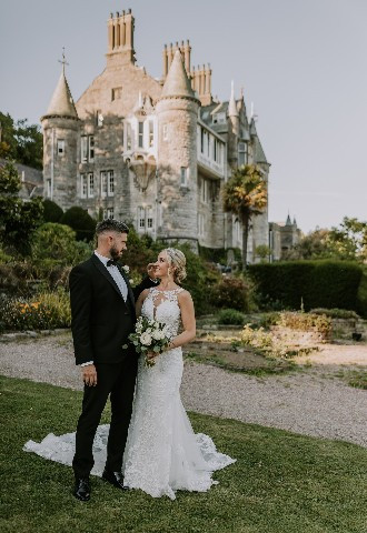 Bride and groom outside Chateau Rhianfa, Anglesey