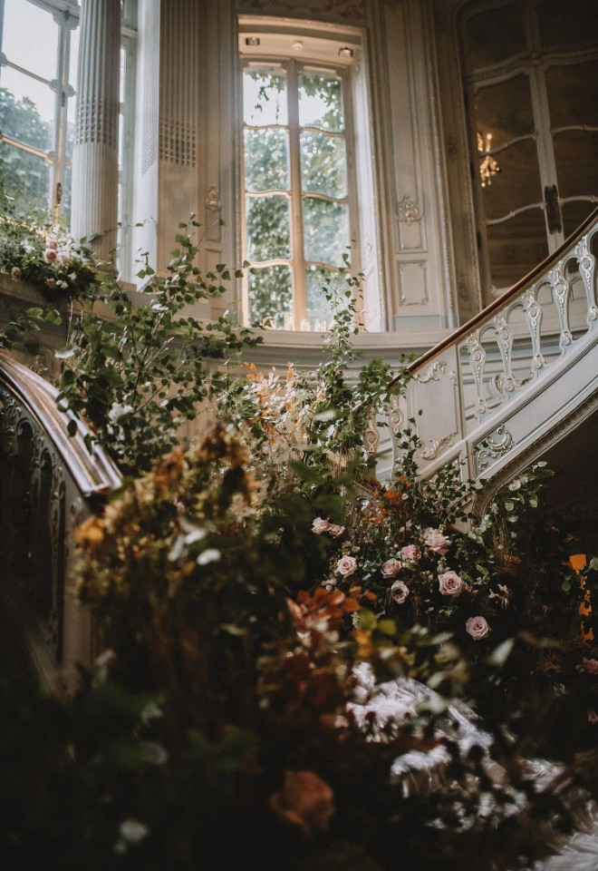 Botanical staircase installation of autumn flowers and foliages at the Savile Club Mayfair