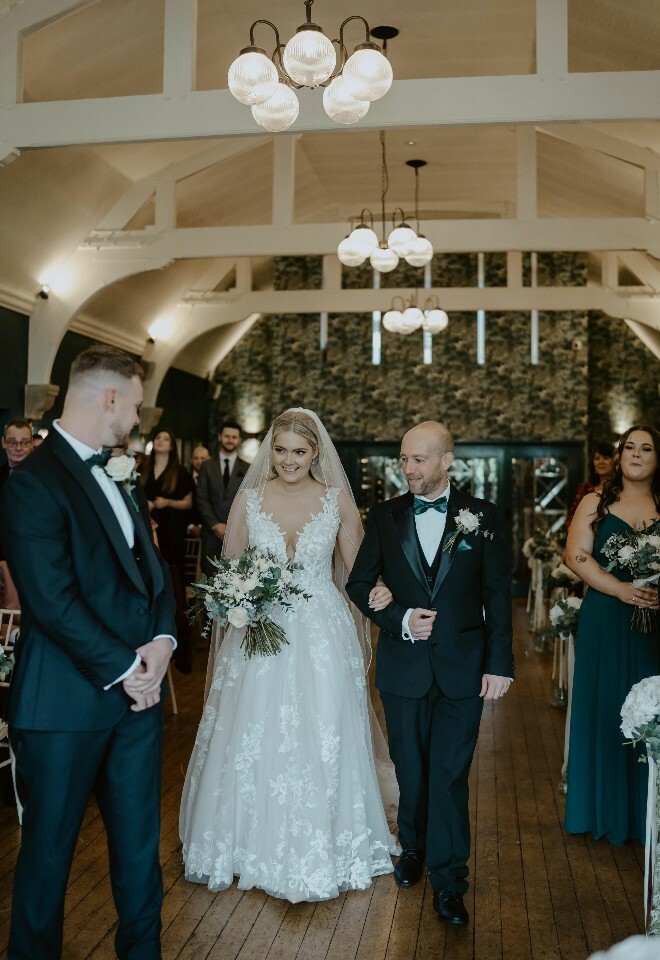 Walking the bride down the aisle in the Beaufort Restaurant