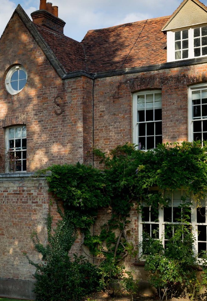 Side of house at That Amazing Place Wedding Venue Essex wisteria