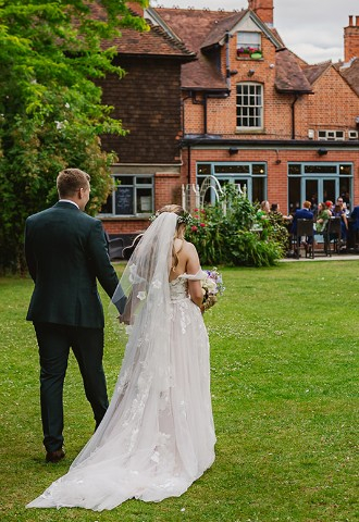Wedding couple in the gardens at The Elephant Hotel - a wedding venue in Berkshire