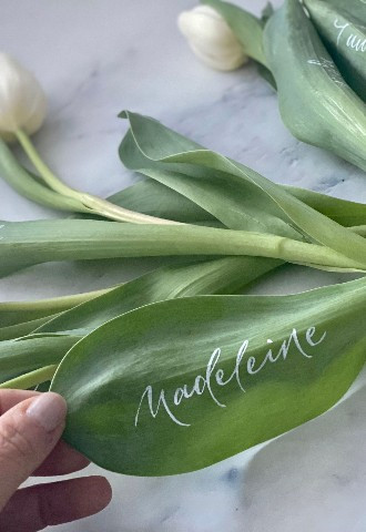 Spring wedding white tulips personalised place name cards in white ink by Mint Lettering calligraphy Buckinghamshire