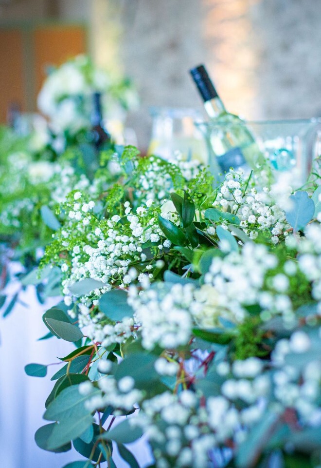 Elegant white and green wedding tablescape with floral centrepieces at castle estate reception in Somerset by FLOWERS BY ANYA