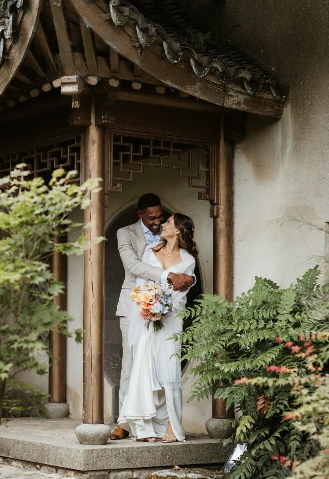 Couple embracing outside venue