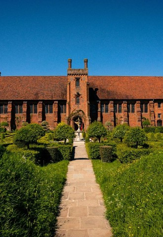 Exterior image of historic Hatfield House with grounds