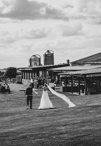 Exterior View of Wedding Venue Skylark Weddings with wedding party enjoying the outdoors