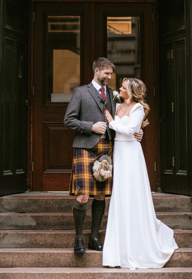 Bride and groom outside The Collector’s Hall wedding venue in Glasgow city centre