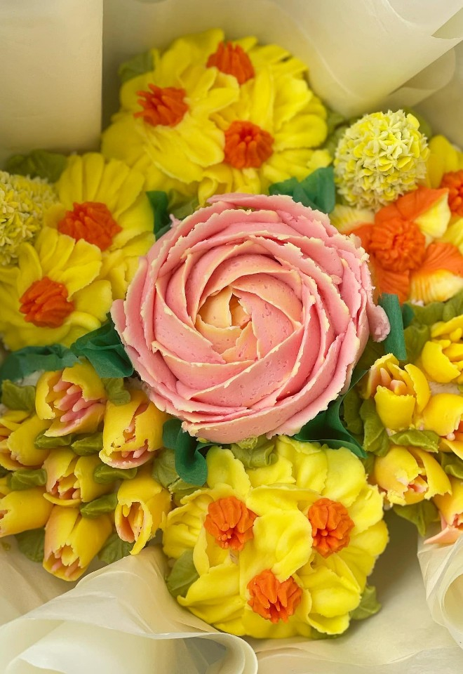 Cake bouquet of yellow tulips, daffodils & pink peony flower type cupcakes for your wedding
