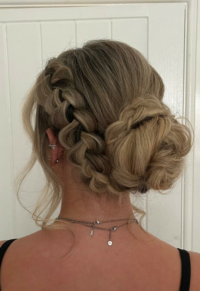 Low messy bun with braids style