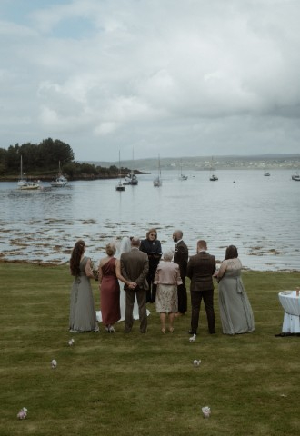 Wedding couple saying vows by loch