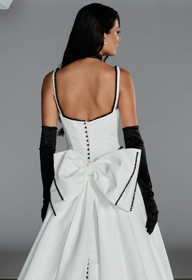 Ballgown dress with bead detail and detachable bow. Available at Your Story Bridal, Marlow.