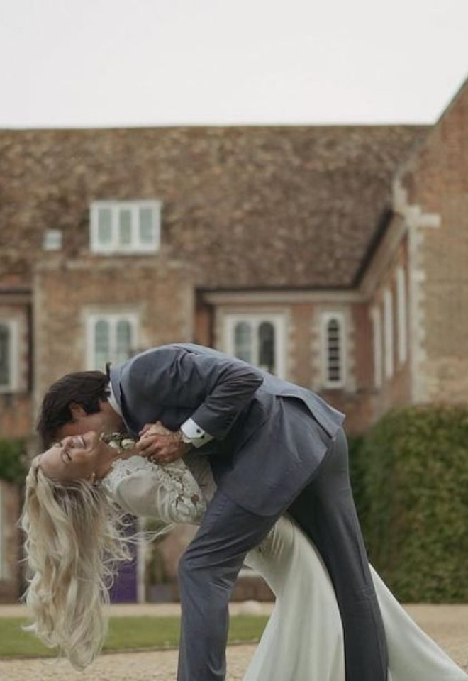 Bride and groom embracing outside of Hockwold Hall wedding venue