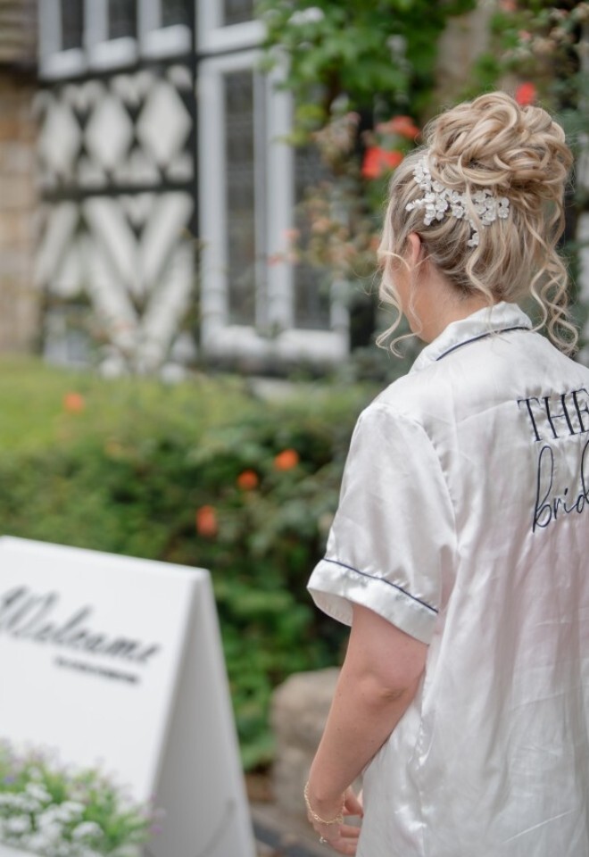 Bride looking at welcome sign