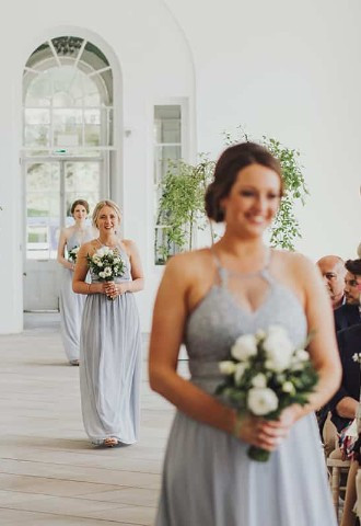 Bridesmaids make their entrance at Margam Orangery, South Wales