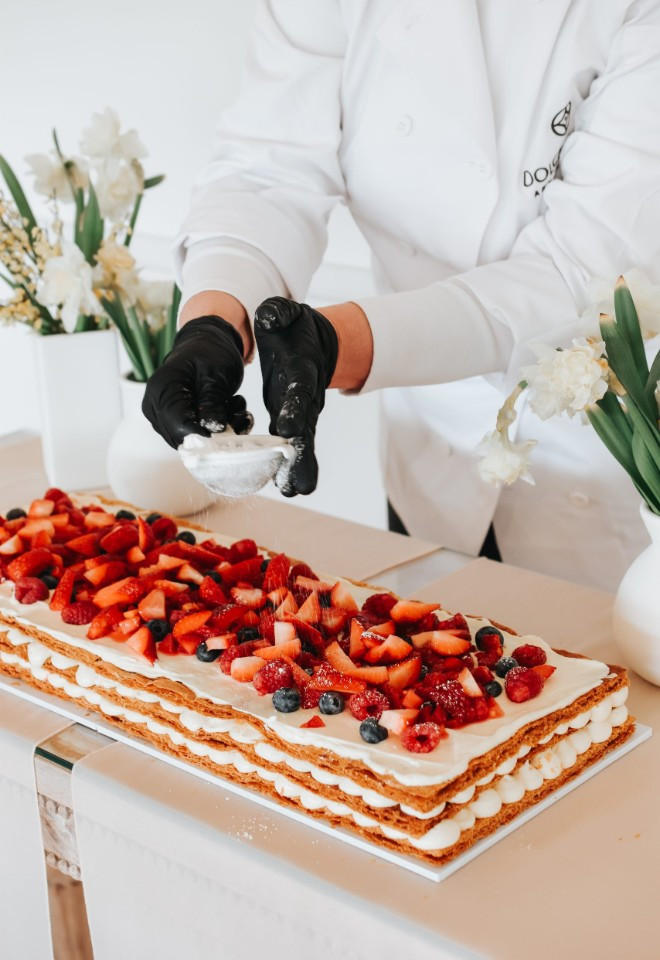 Dolce Lusso Cakes creating a traditional Italian Millefoglie wedding cake with fresh berries, cream and layers of crisp pastry.