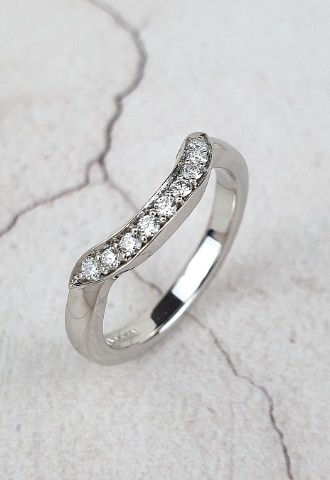 Unique shaped wedding ring set with small diamonds