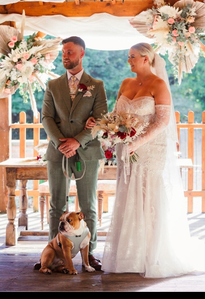 Bride and groom with poochy. 