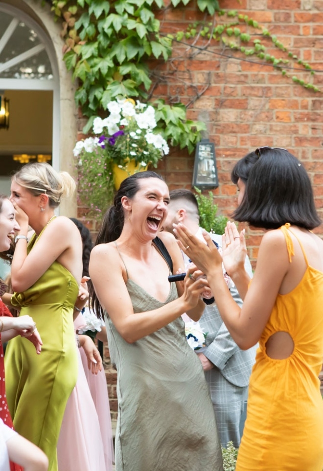 Guests laughing wedding Photographer Milton Keynes