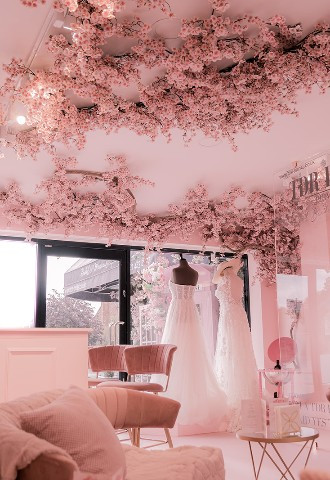 Pink theme with flowers on the ceiling inside TDR Bridal Birmingham - The Dressing Rooms