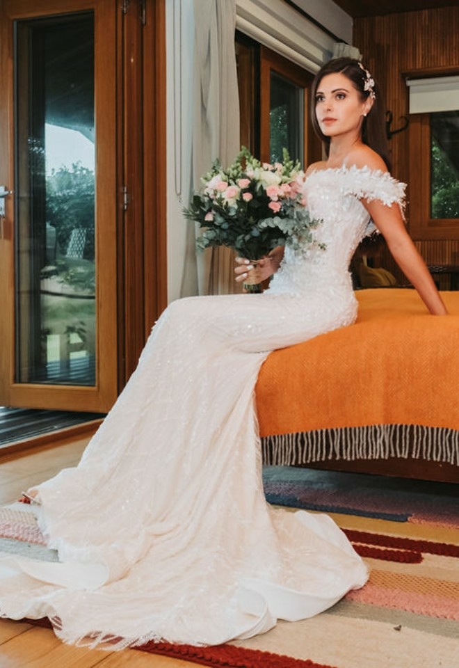 Brie sitting on bed at the Chilterns view Wedding Venue