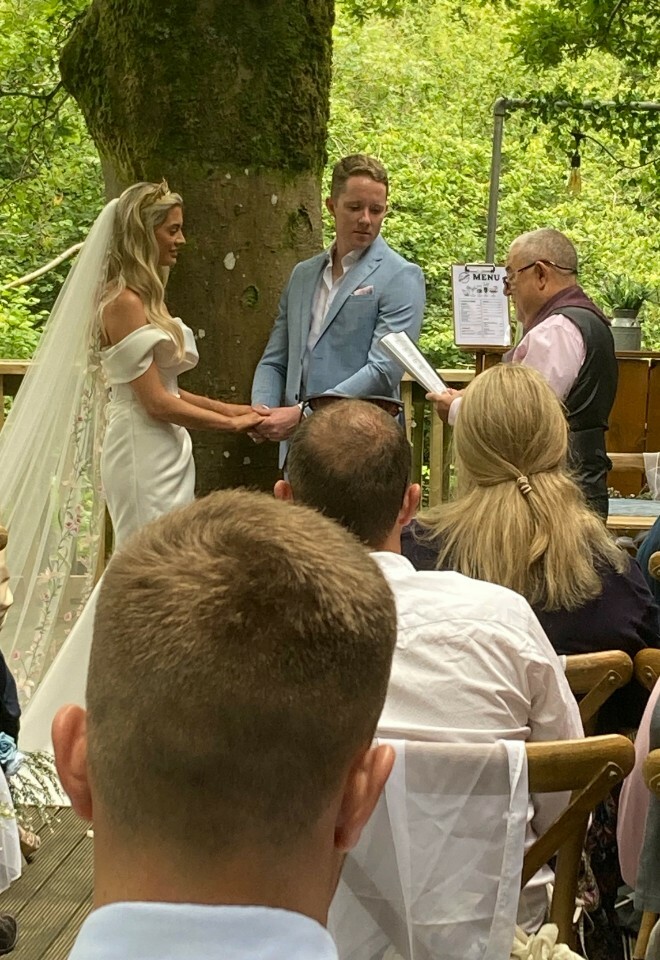 Trevor English performing wedding ceremony outdoors