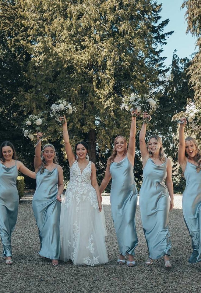 A bride and bridesmaids celebrating at a country wedding venue in Northamptonshire