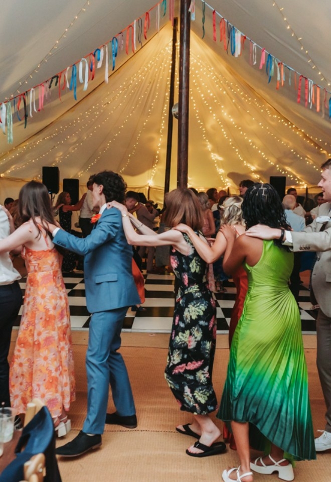Conga in marquee, lit up for evening