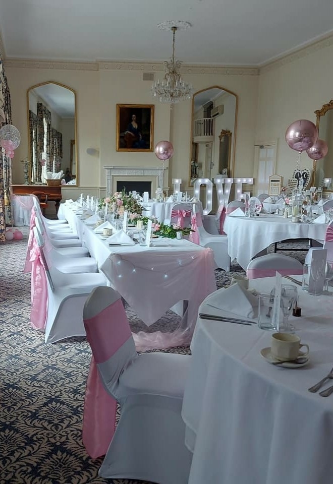 Sussex wedding with decor from inflate 2 create balloons, chair covers lights, sashes & flowers