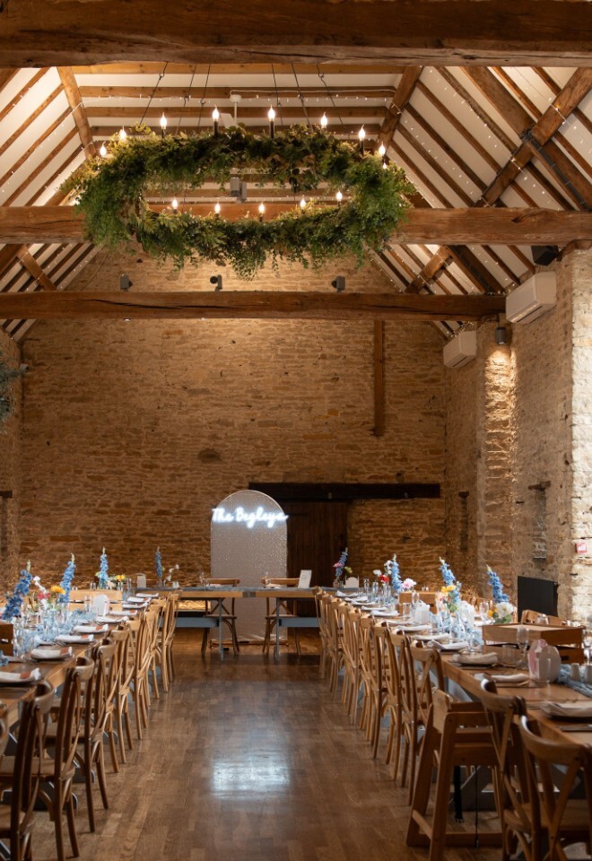 A barn used for dining and food in an Oxfordshire barn wedding venue
