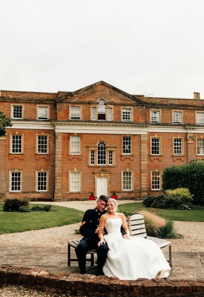 Couple seated on a bench at the back of the venue