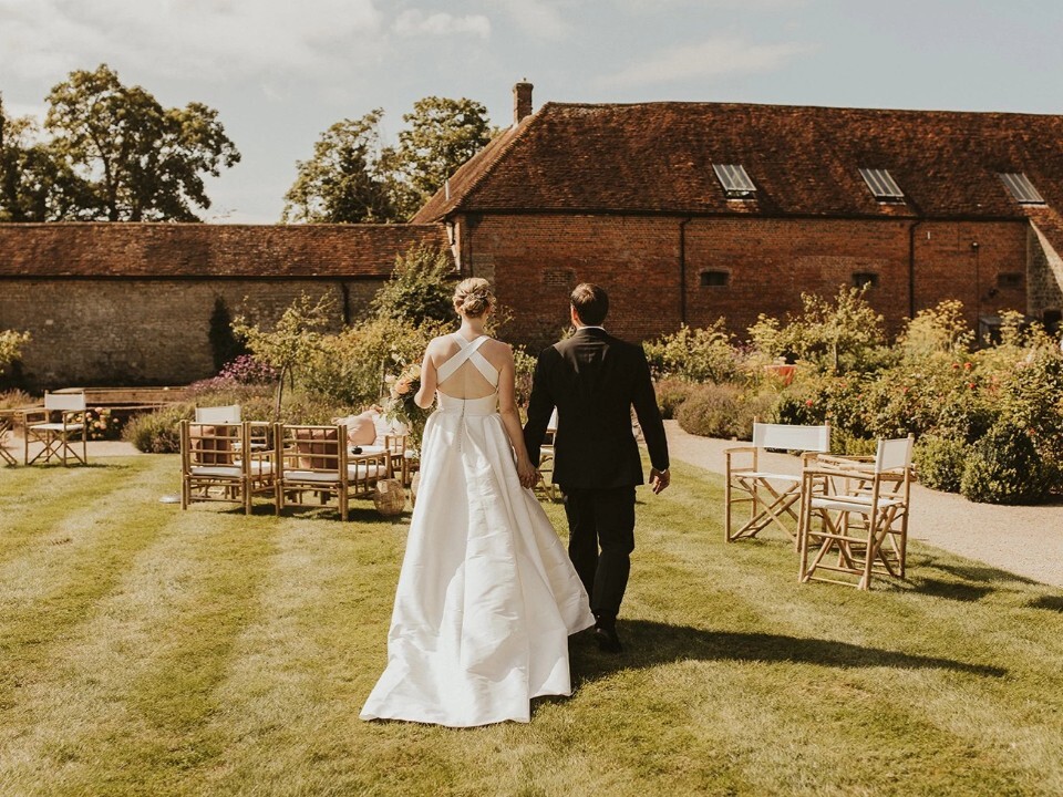 A couple outside a barn venue 